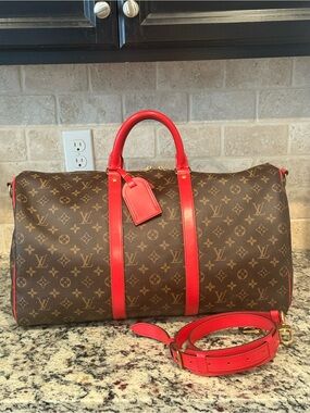 Louis Vuitton Monogram Duffel Bag with Red Leather Trim
